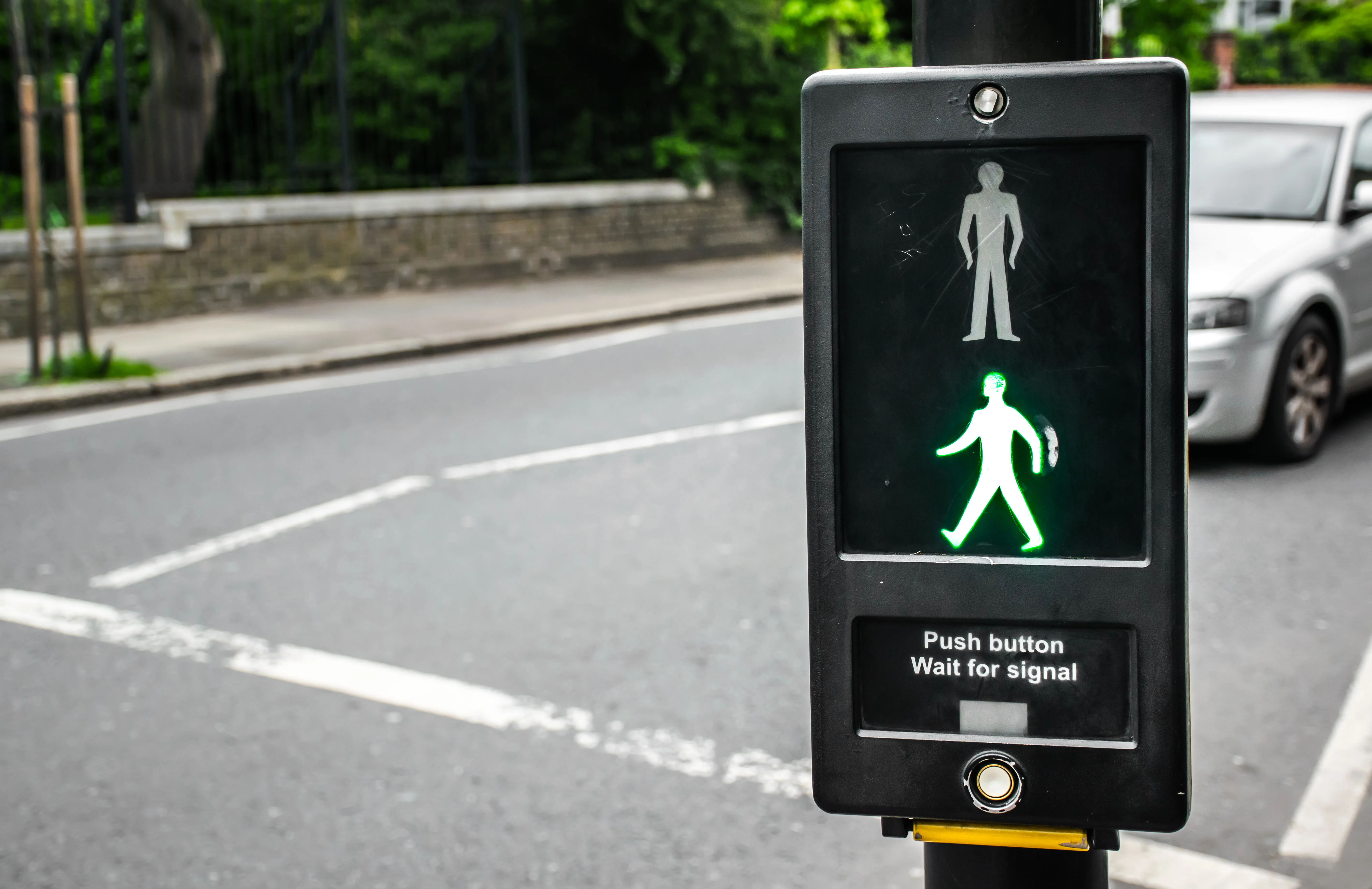 Push the button wait for signal. Pedestrians safety concept.